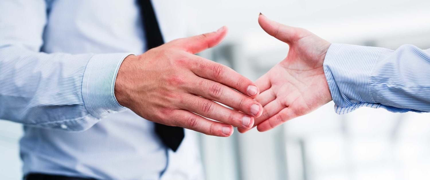 Close Up of Two Business People Shaking Hands
