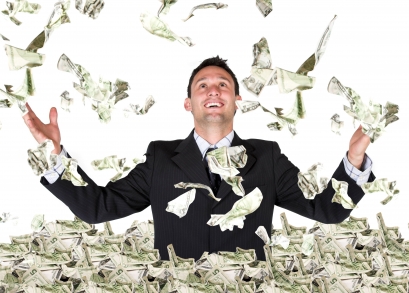 A man in a business suit throwing money in the air