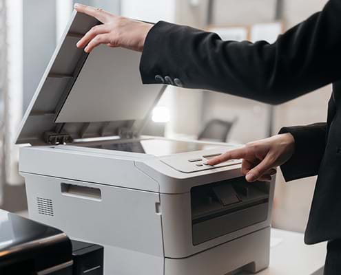 Close Up of Business Person Using Copier Machine